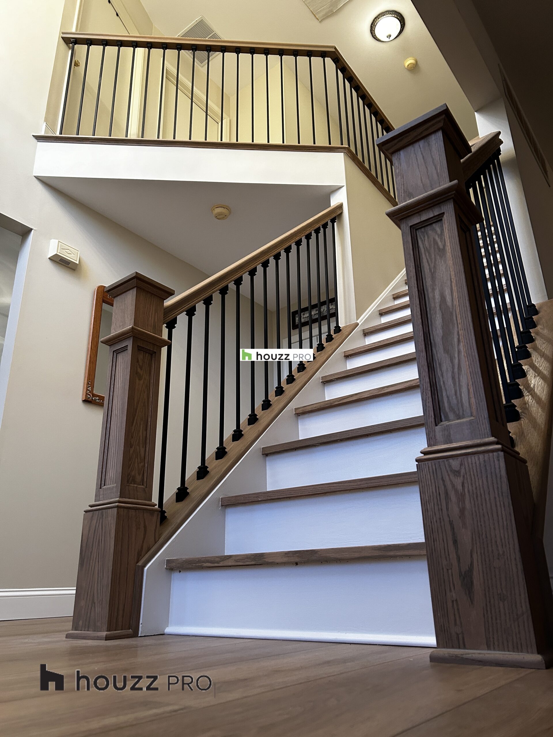 Staircase with custom railings and hardwood steps