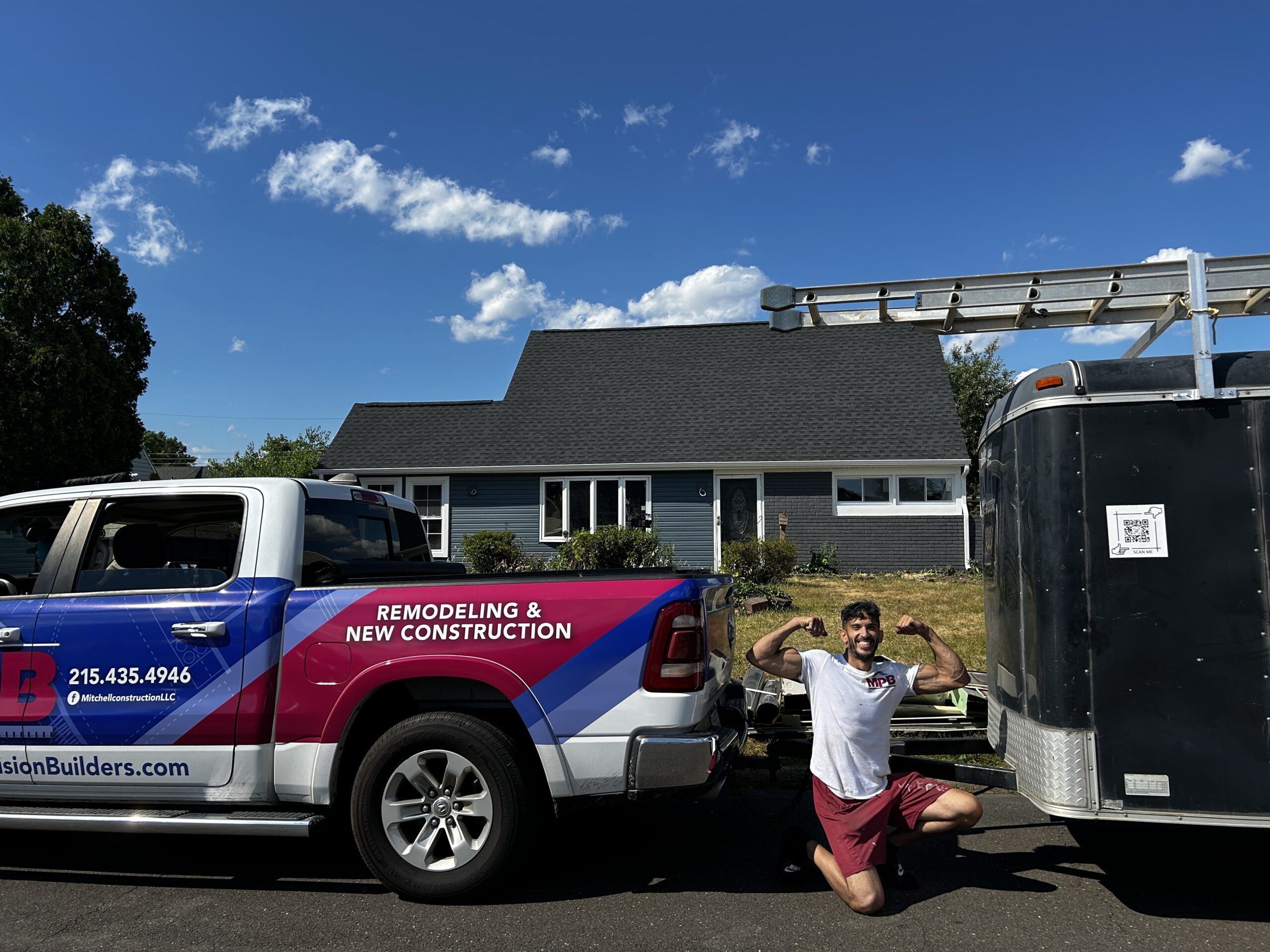 New roof and siding on Bucks County home with fresh white trim.