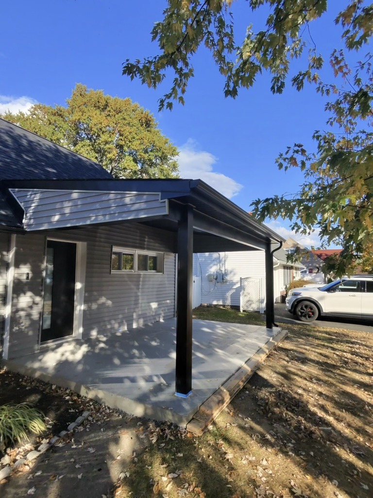 Exterior detail with fresh gutters and downspouts.