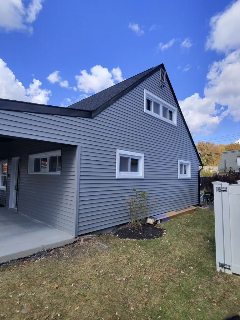 New roof, siding and porch on remodeled home.